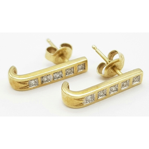 488 - A Pair of 9 Carat Gold ‘J Shape’ Diamond Stud Earrings. Set with Ten 1.5mm Square Cut Diamonds (Appr... 