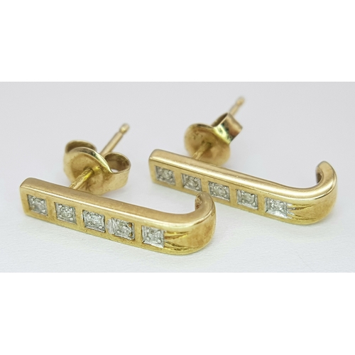 488 - A Pair of 9 Carat Gold ‘J Shape’ Diamond Stud Earrings. Set with Ten 1.5mm Square Cut Diamonds (Appr... 