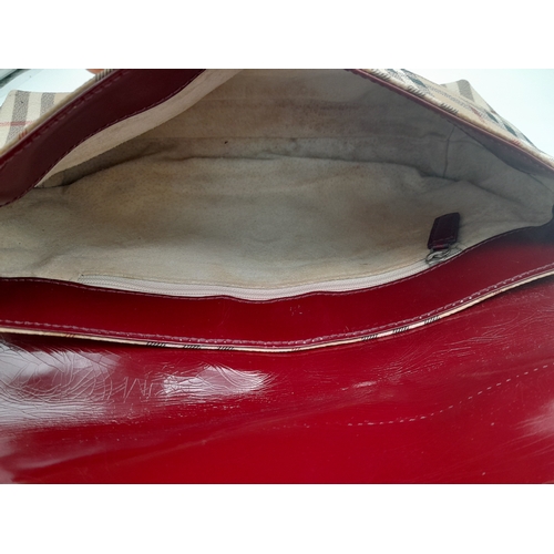 550 - A Burberry Haymarket Shoulder Bag. Check Pattern with Red Patent Leather. 27cm Wide by 15cm Tall.