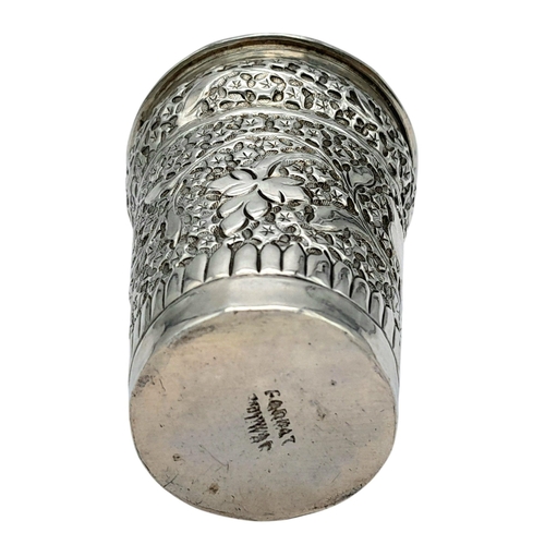 1323 - A Vintage Silver Kiddush Cup. Chased floral decoration. 34g. 7cm