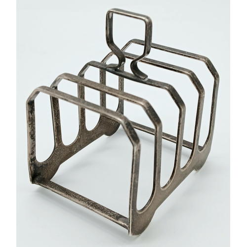 1309 - A Vintage Sterling Silver Toast Rack. Birmingham hallmarks. 90g. 8 x 6cm.