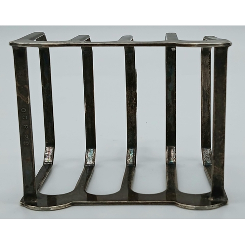 1309 - A Vintage Sterling Silver Toast Rack. Birmingham hallmarks. 90g. 8 x 6cm.