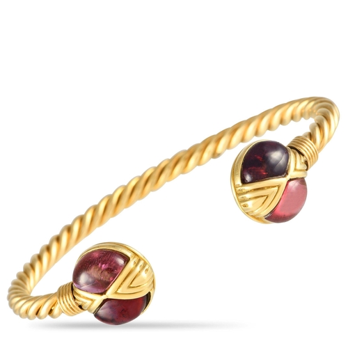 719 - A Bvlgari 18K Yellow Gold Tourmaline Bracelet. Designed as a rigid twisted rope cuff with open ends.... 