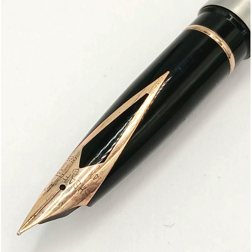 105 - Vintage SHEAFFER FOUNTAIN PEN finished in brushed stainless steel . Having a 14 Carat Gold Nib. Exce... 