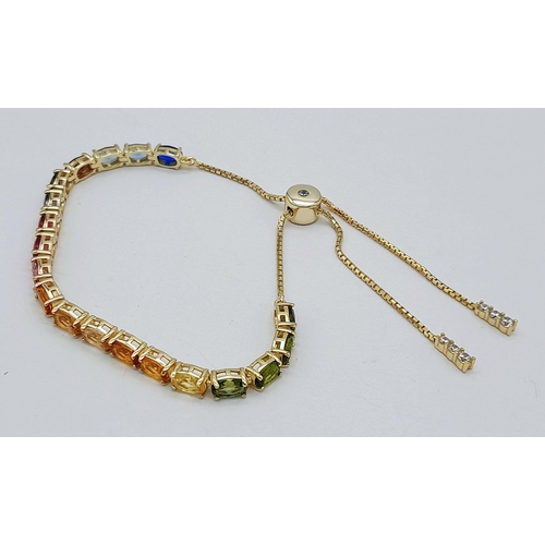 1076 - A Yellow Gold Gilt Sterling Silver Multi Colour Stone Pull Through Bracelet. One Size Adjustable Fit... 