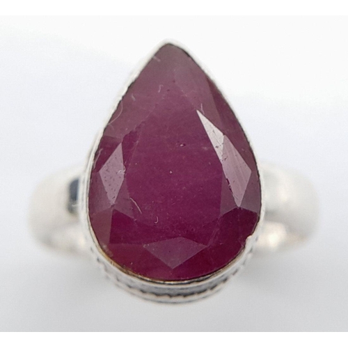 113 - A STERLING SILVER RUBY SET RING PEAR SHAPE RUBY APPROX 6CT , 5.9G , SIZE O 1/2. Ref: 9273