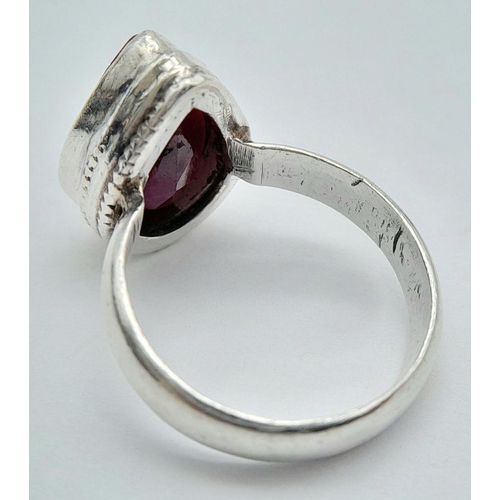 113 - A STERLING SILVER RUBY SET RING PEAR SHAPE RUBY APPROX 6CT , 5.9G , SIZE O 1/2. Ref: 9273