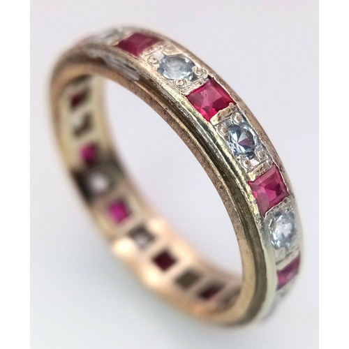 179 - A 9K YELLOW GOLD DIAMOND & RUBY FULL ETERNITY RING. 3G. SIZE N. ADAM2003.