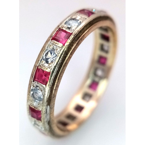 179 - A 9K YELLOW GOLD DIAMOND & RUBY FULL ETERNITY RING. 3G. SIZE N. ADAM2003.