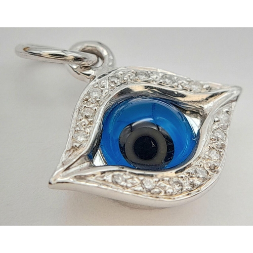 198 - AN 18K WHITE GOLD DIAMOND SET EVIL EYE PENDANT / CHARM 1.4CM x 1CM, 1.9G TOTAL WEIGHT,. Ref: SC 2052