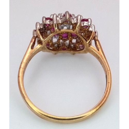 270 - A 9K YELLOW GOLD DIAMOND & RUBY CLUSTER RING 2.3G TOTAL WEIGHT, SIZE L. Ref: SC 2009