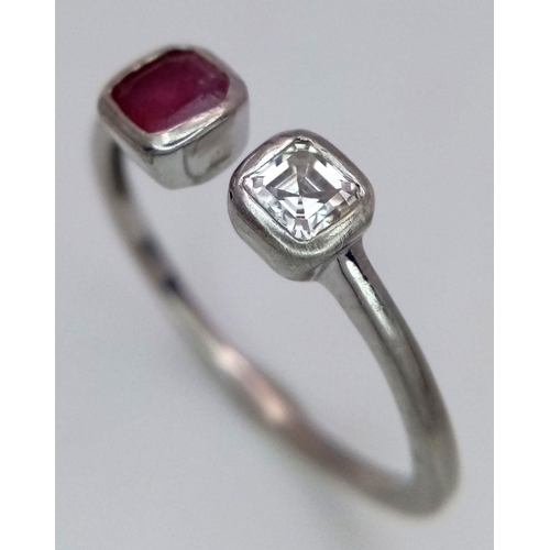 438 - A Unisex Sterling Silver Ruby & Diamond Ring Size T. The ring is set with a 4mm Square Cut Ruby and ... 