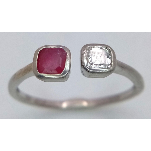 438 - A Unisex Sterling Silver Ruby & Diamond Ring Size T. The ring is set with a 4mm Square Cut Ruby and ... 