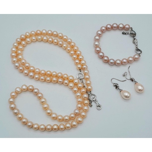 461 - A CULTURED PEARL NECKLACE, BRACELET & DROP EARRING SUITE - WITH STERLING SILVER FITTINGS. NECKLACE -... 