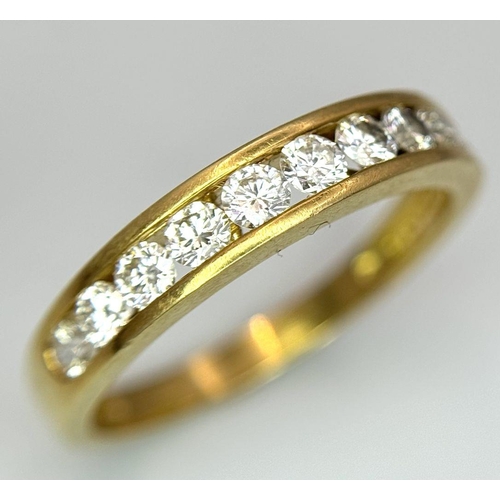 52 - AN 18K YELLOW GOLD CHANNEL SET DIAMOND HALF ETERNITY RING 0.75CT, 3.5G TOTAL WEIGHT, SIZE S. Ref: SC... 