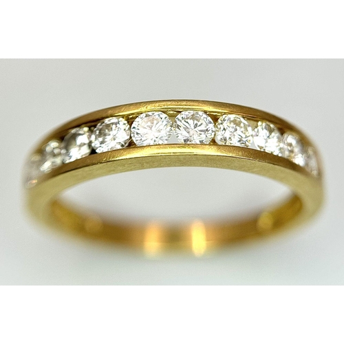 52 - AN 18K YELLOW GOLD CHANNEL SET DIAMOND HALF ETERNITY RING 0.75CT, 3.5G TOTAL WEIGHT, SIZE S. Ref: SC... 