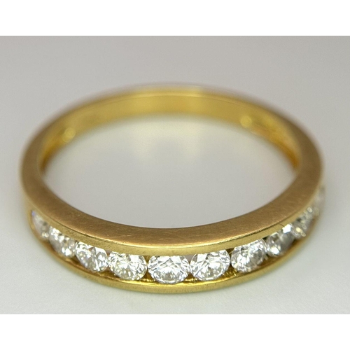 52 - AN 18K YELLOW GOLD CHANNEL SET DIAMOND HALF ETERNITY RING 0.75CT, 3.5G TOTAL WEIGHT, SIZE S. Ref: SC... 