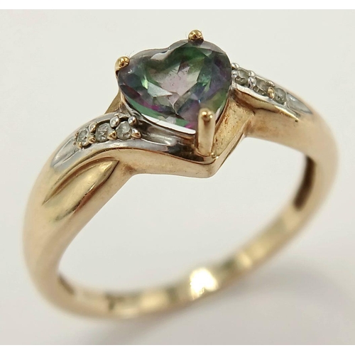 564 - A 9 Carat Yellow Gold Mystic Topaz and Diamond Heart Ring Size L1/2. The Ring is set with a 6mm long... 