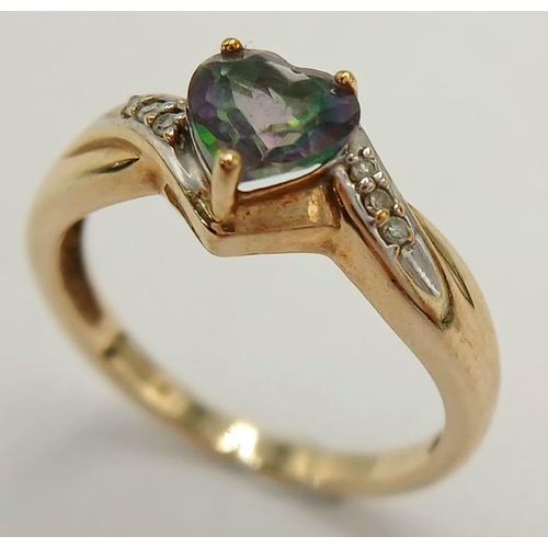 564 - A 9 Carat Yellow Gold Mystic Topaz and Diamond Heart Ring Size L1/2. The Ring is set with a 6mm long... 