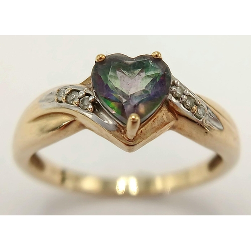 564 - A 9 Carat Yellow Gold Mystic Topaz and Diamond Heart Ring Size L1/2. The Ring is set with a 6mm long... 