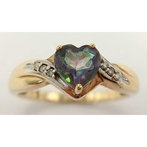 564 - A 9 Carat Yellow Gold Mystic Topaz and Diamond Heart Ring Size L1/2. The Ring is set with a 6mm long... 