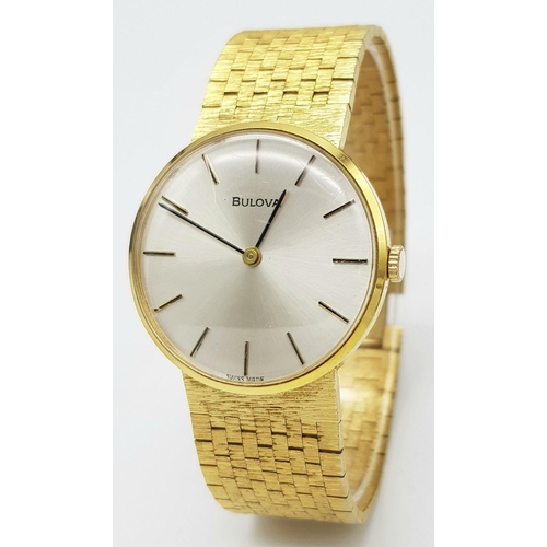 578 - A Men’s Swiss Gold Tone Manual Wind Watch by Bulova. 33mm Case. Comes with Spare Link and Original B... 