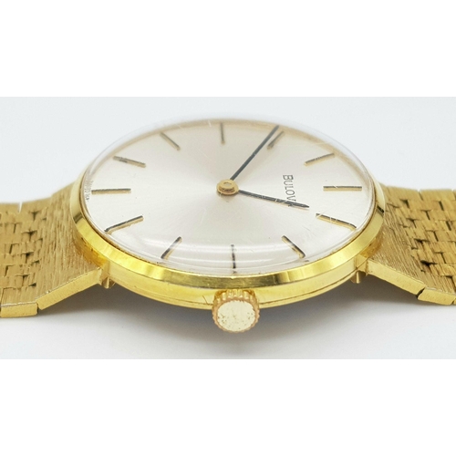 578 - A Men’s Swiss Gold Tone Manual Wind Watch by Bulova. 33mm Case. Comes with Spare Link and Original B... 