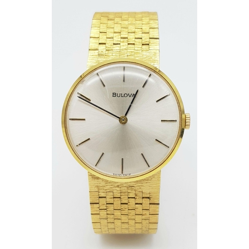 578 - A Men’s Swiss Gold Tone Manual Wind Watch by Bulova. 33mm Case. Comes with Spare Link and Original B... 