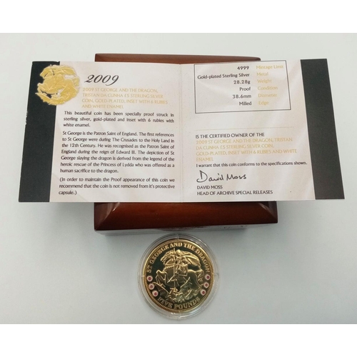 599 - A Mint Condition 2009 Gold Plated Sterling Silver, £5 St George Coin, Set with Six Round Cut Rubies.... 