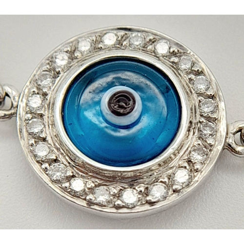 66 - AN 18K WHITE GOLD DIAMOND SET EVIL EYE BRACELET 14CM LENGTH, 4.2G TOTAL WEIGHT. Ref: SC 9007