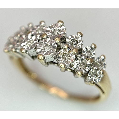 165 - A 9K YELLOW GOLD DIAMOND 2 ROW RING. 2.7G. SIZE M.
AS1189.