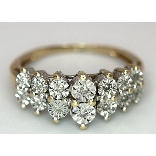 165 - A 9K YELLOW GOLD DIAMOND 2 ROW RING. 2.7G. SIZE M.
AS1189.