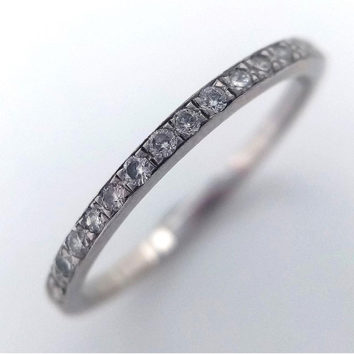 219 - AN 18K WHITE GOLD ( TESTED ) DIAMOND BAND RING 0.20CT , 1.3G TOTAL WEIGHT, SIZE M 1/2. Ref: SC 2045