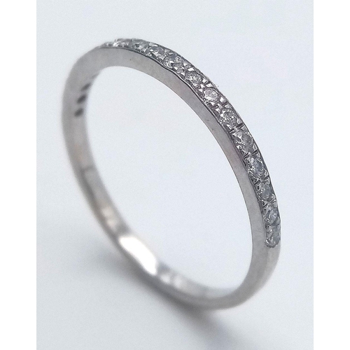 219 - AN 18K WHITE GOLD ( TESTED ) DIAMOND BAND RING 0.20CT , 1.3G TOTAL WEIGHT, SIZE M 1/2. Ref: SC 2045