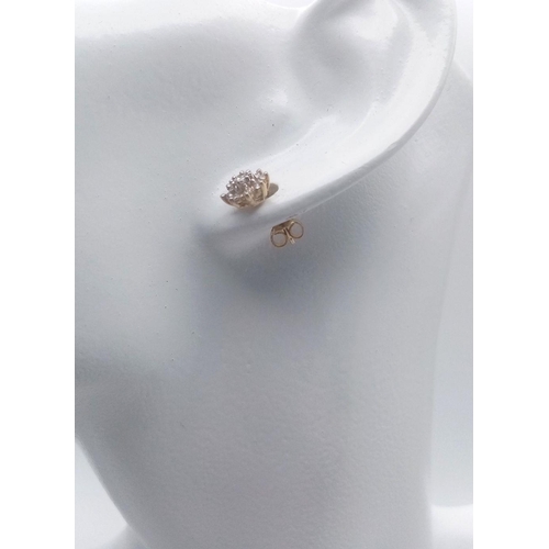 226 - A PAIR OF 14K YELLOW GOLD DIAMOND CLUSTER STUD EARRINGS 0.40CT , 1.5G TOTAL WEIGHT. Ref: SC 2042