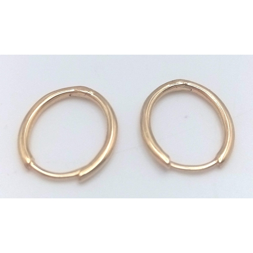 517 - A PAIR OF 9K YELLOW GOLD OVAL SLEEPER HOOP EARRINGS 1G TOTAL WEIGHT, 1.1CM DIAMETER. Ref: SC 2002