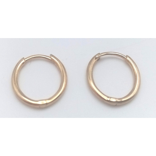 517 - A PAIR OF 9K YELLOW GOLD OVAL SLEEPER HOOP EARRINGS 1G TOTAL WEIGHT, 1.1CM DIAMETER. Ref: SC 2002