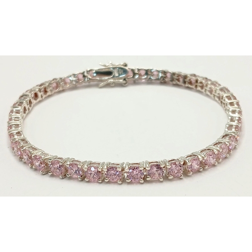 610 - A Sterling Silver and Pink Tourmaline Set Tennis Bracelet-19.5cm Length. The bracelet is set with Fo... 