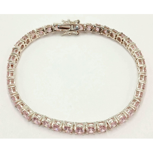 610 - A Sterling Silver and Pink Tourmaline Set Tennis Bracelet-19.5cm Length. The bracelet is set with Fo... 