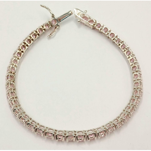 610 - A Sterling Silver and Pink Tourmaline Set Tennis Bracelet-19.5cm Length. The bracelet is set with Fo... 