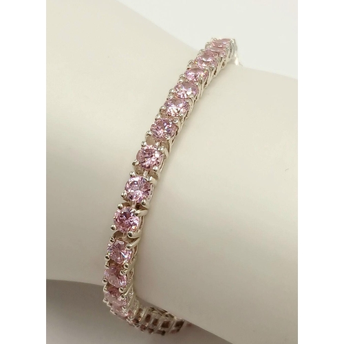 610 - A Sterling Silver and Pink Tourmaline Set Tennis Bracelet-19.5cm Length. The bracelet is set with Fo... 