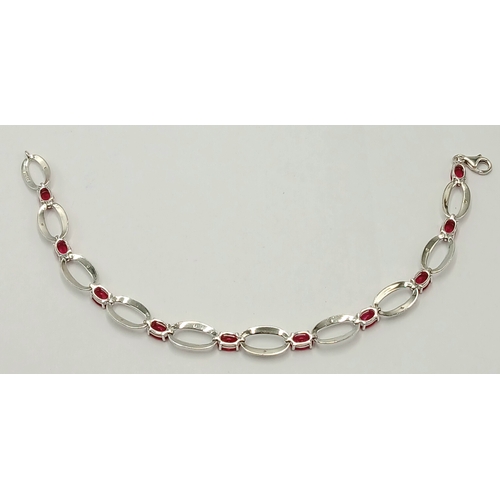 669 - A Sterling Silver Ruby and Cubic Zirconia Set Bracelet-19.5cm Length. The Bracelet Measures 8mm Wide... 