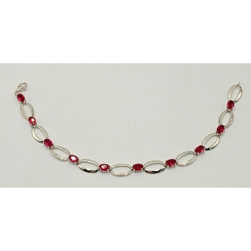 669 - A Sterling Silver Ruby and Cubic Zirconia Set Bracelet-19.5cm Length. The Bracelet Measures 8mm Wide... 