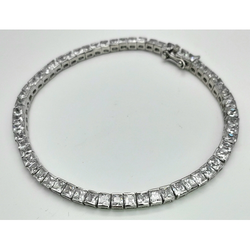 1048 - A Sterling Silver Clear Stone Set Tennis Bracelet- 19.5cm Length. The bracelet measures 4mm Wide and... 