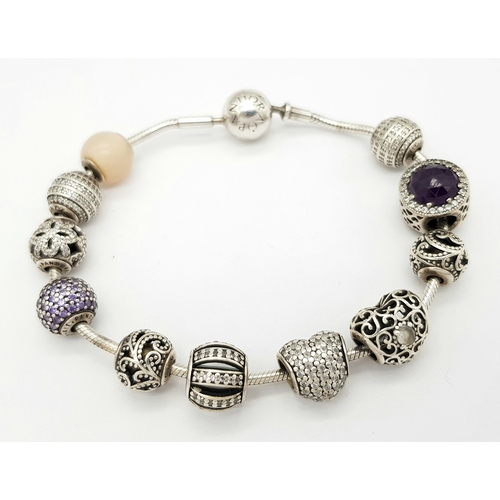 273 - Genuine PANDORA SILVER BRACELET and CHARMS.