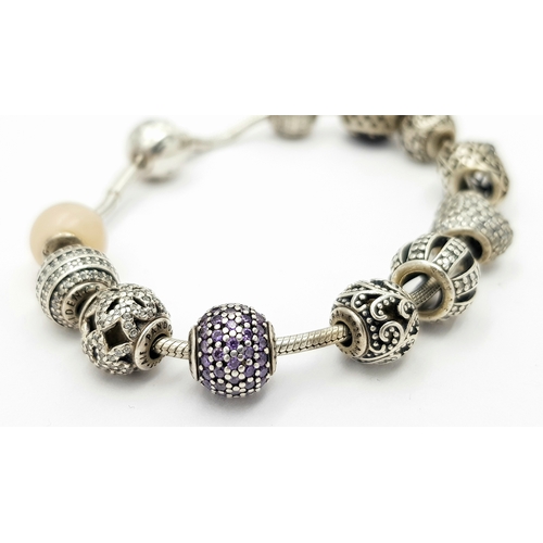 273 - Genuine PANDORA SILVER BRACELET and CHARMS.