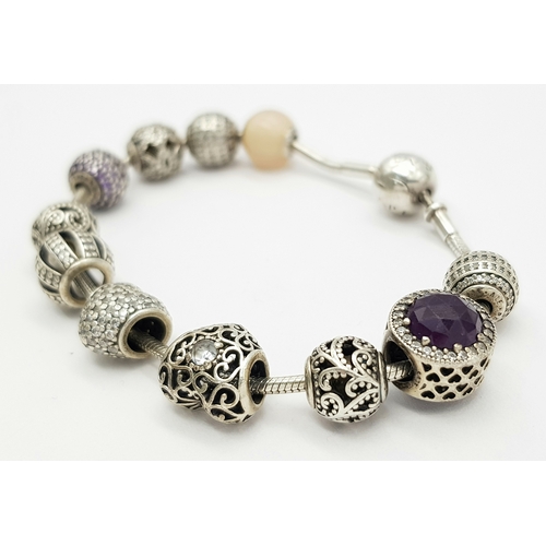 273 - Genuine PANDORA SILVER BRACELET and CHARMS.