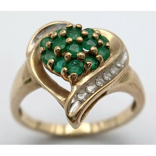 557 - A Quality 9 Carat Yellow Gold Emerald and Diamond Heart Design Ring Size N. The ring is set with 13 ... 