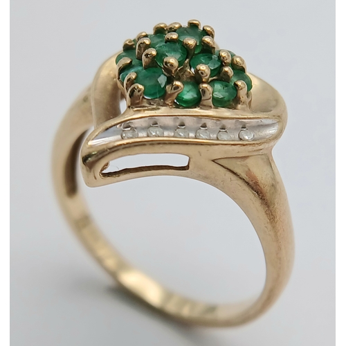 557 - A Quality 9 Carat Yellow Gold Emerald and Diamond Heart Design Ring Size N. The ring is set with 13 ... 