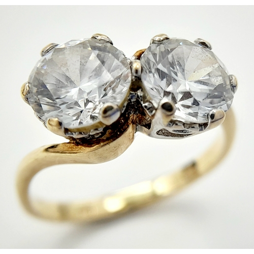 56 - Fabulous 9 CARAT GOLD RING. Crossover style with 2 x large beautifully cut SEARCHLIGHT ZIRCONIAS. 2.... 